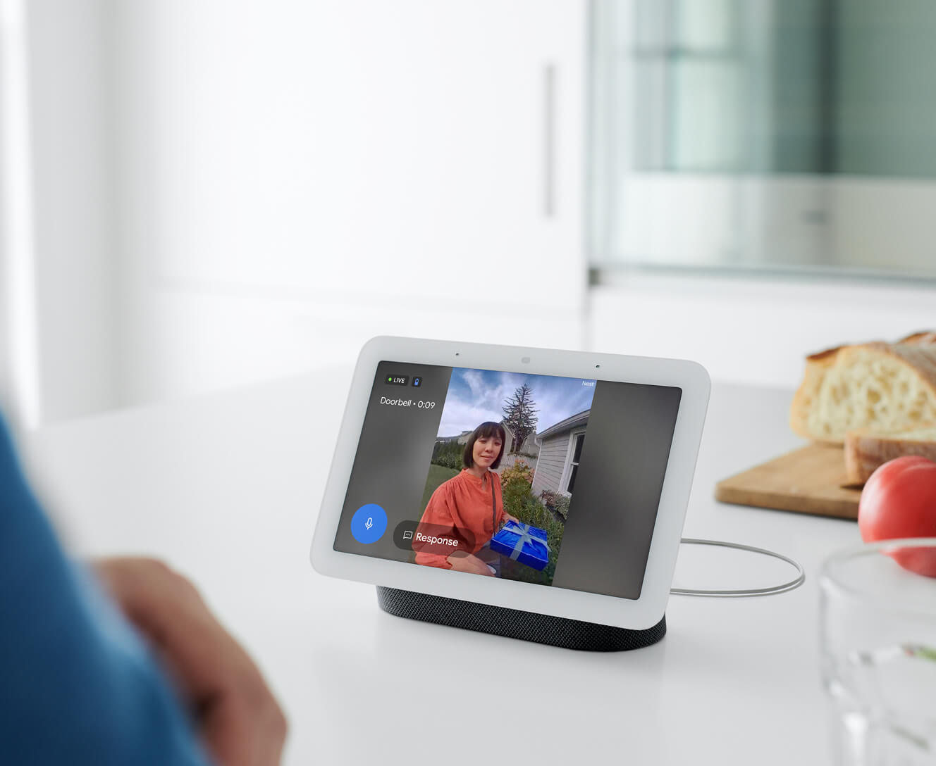 Google Nest Hub 2 Gen on a kitchen table showing the front door is locked